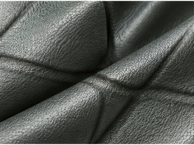 Black action leather with textured grain and padded folds